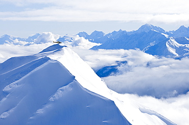 Coastal Helicopter flying over Chilkat Mountains in Haines, Alaska, United States of America