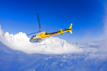 Coastal Helicopter taking off from Chilkat Mountains in Haines, Alaska, United States of America