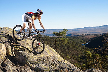 Octavio Vicente Cetto goes down through a high rock in Rancho Santa Elena, Hidalgo, Mexico, Mexico