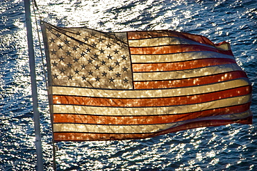 AMERICAN FLAG WITH LAKE IN BACKGROUND, United States of America