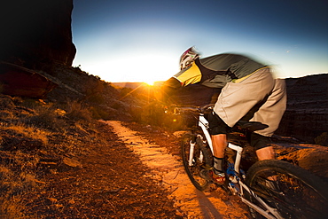 Kyle Mears mountain biking on the Porcupine Rim trail, Moab, Utah, United States of America