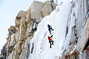 Corey Rich photographs Zach Fletcher while ice climbing in Lee Vining, CA, United States of America