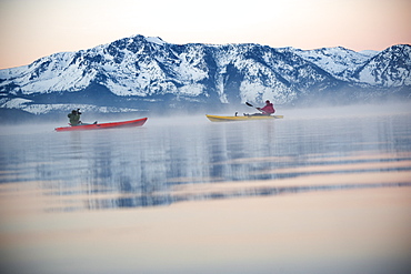 Corey Rich photographs Spencer Ray during an early morning paddle on Lake Tahoe, Stateline, NV, United States of America