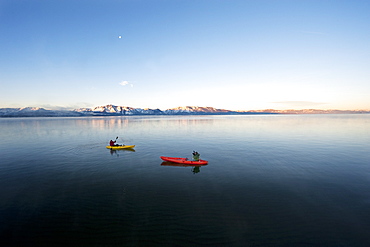 Corey Rich photographs Spencer Ray during an early morning paddle on Lake Tahoe, Stateline, NV, United States of America