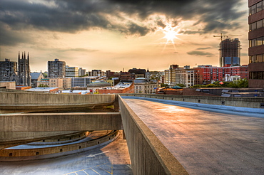 July 26, 2008 - The sun sets and reflects on the entrance ramp leading to the upper deck of a parking garage overlooking the skyline of Stamford, Connecticut. The building under construction is a luxury apartment building being built by Donald Trump and will become the tallest building in Stamford, United States of America