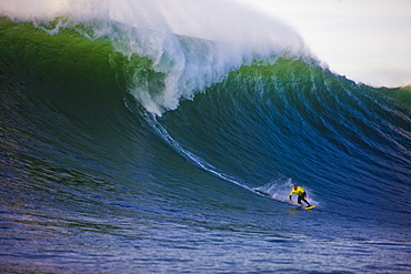 Jake Wormhoudt prepares for a bottom turn on a wave off Nelscott Reef on the Oregon coast, United States of America