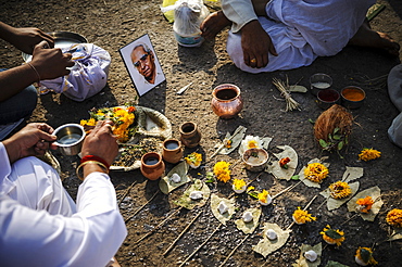 Performing a ceremony for the deceased family members at the Godavari river, Nashik, Maharashtra, India.