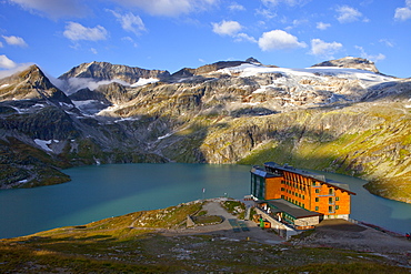 The Rudolfshut with the Weisssee mountain lake, one of the huts hikers stay at during the Glocknerrunde, a 7 stage trekking from Kaprun to Kals around the Grossglockner, the highest mountain of Austria.