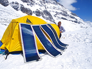 Manaslu mountaineering expedition 2008, Nepal Himalayas: Mountaineers are using solar panels to charge elcetronic equipment.