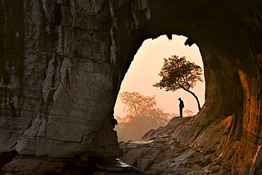 Chinese man meditates under a tree, Guilin, China