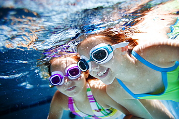 girls swimming in the pool