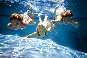 girls swimming in the pool