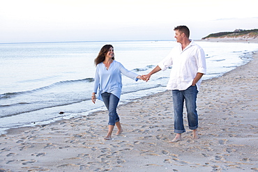 A couple are photographed at a Cape Cod beach, Dennis, Massachusetts, United States of America