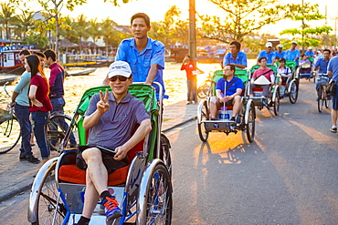 Tourists on a Cyclo tour of Hoi An Ancient Town, Hoi an, Quang Nam Province, Vietnam