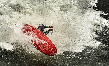 Spanish kayaker Aniol Serrasolses is riding the waves of the spanish coast with a freestyle kayak.