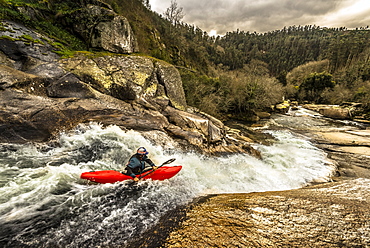 Spanish whitewater kayaking is paddling down a slide of the Rio Umia.