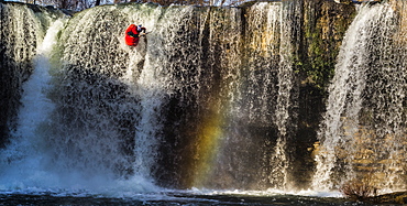 Spanish whitewater kayaker drops down the 40-foot "Tobalina Falls" in Pedrosa de Tobalina, Spain.