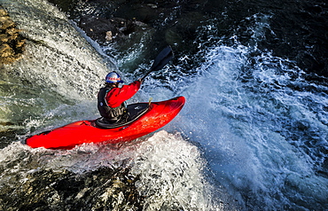 Spanish whitewater kayaker drops down the 40-foot "Tobalina Falls" in Pedrosa de Tobalina, Spain.