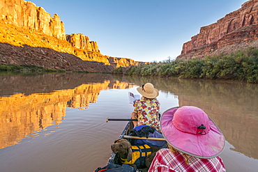 A mother and daughter canoeing along the  Labyrinth Canyon section of the Green RIver, Green River, Utah.