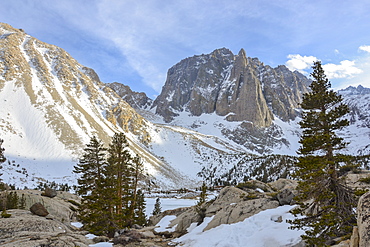 Temple Crag looms over frozen First Lake in the Eastern SIerra Nevada, California.