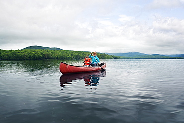 Mother and young sun canoeing in Kezar Lake