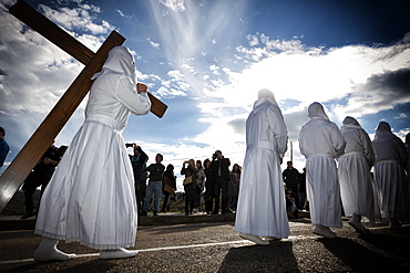 Bercianos De Aliste, Castilla and Leon, Spain. Traditional robed and hooded penitents from the 'Santo Entierro' brotherhood take part in a religious procession on Holy Friday in Bercianos de Aliste