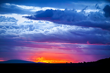 The sunset sets over the African savannah