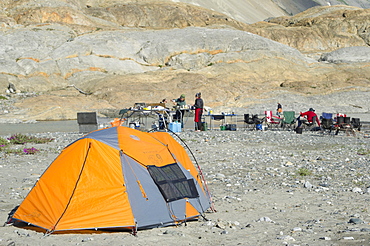 Solar panel hanging from tent along the shores of the Alsek River