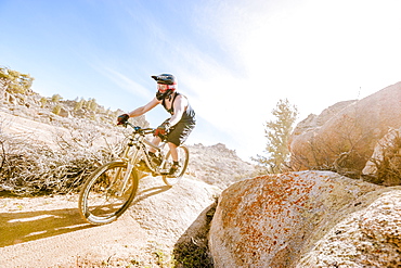 Man Mountain Biking On Rocky Landscape In Gunnison