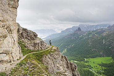 Woman Hiking Through Cengia Martini Of The Kaisejager