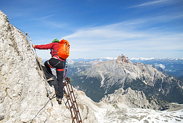 Man Climbing At Via Ferrata Ivano Dibona In The Dolomites, Italy