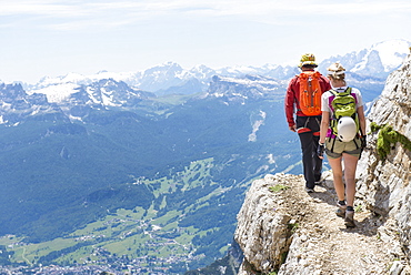 A Couple Climbing At The Via Ferrata Ivano Dibona