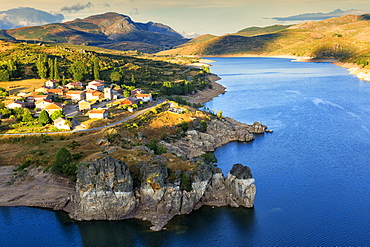 Camporredondo Reservoir And The Village Of Alba De Los Cardanos In Palencia Province, Northern Spain