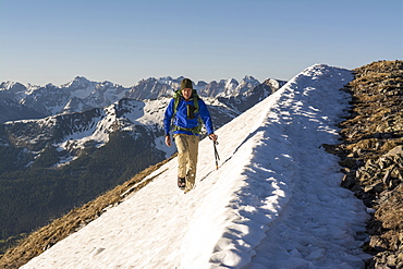 A Man Hiking A Snowslope Above Molas Pass In San Juan National Forest, Durango, Colorado