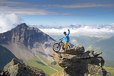 Successful Mountain Biker Reach The Top Of Mountain In Switzerland