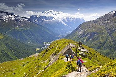 Hikers Are Descending From Aiguillette Des Posettesinto The Chamonix Valley