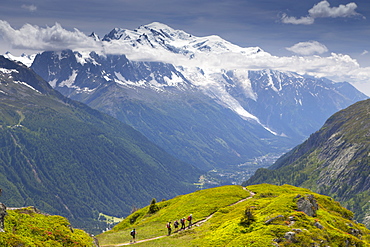 Distant View Of Hikers Hiking From Aiguillette Des Posettes Into The Chamonix Valley