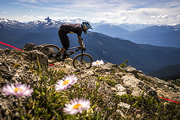 A Mountain Biker Riding On Rocky Landscape In Whistler, British Columbia, Usa