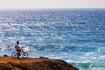 Cyclist Exploring Oceanic View In Sintra Cascais Natural Park