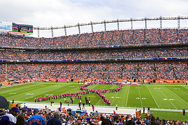 Women Create A Breast Cancer Awareness Ribbon On Sports Authority Field At Mile High Stadium