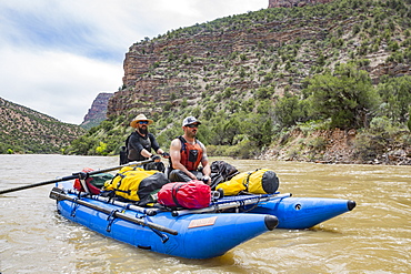 Two Men Rafting In Yampa And Green Rivers Through Dinosaur National Monument