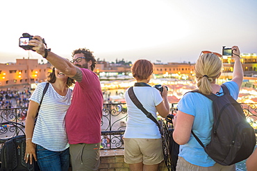 Tourists Take Selfies Above Bustling Djemaa El Fna At Night