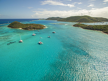 Sailboats Rest In The Clear Waters Near Prickly Pear Island In The British Virgin Islands