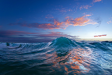 An Ocean Wave In The Early Morning Light On The East Side Of Oahu