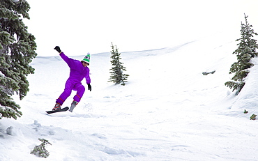 Male Skier Skiing On Snowy Landscape