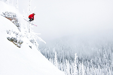 Male Skier Catches Air At Whitefish Mountain Resort In Whitefish, Montana, Usa