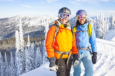 Two Female Backcountry Skiers On Snowy Landscape In Northwest Montana