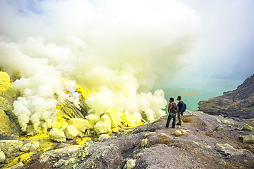 Two Male Hikers In Volcano Kawah Ijen, Java, Indonesia