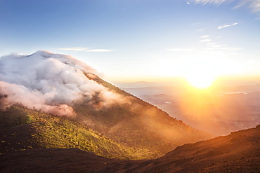 The Orange Sun Showers The Banks Of Pacaya Volcano At Pacaya National Park, Escuintla, Guatemala