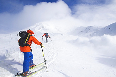 Two Backcountry Skiers Are Ascending To The Highest Mountain Of Hokkaido